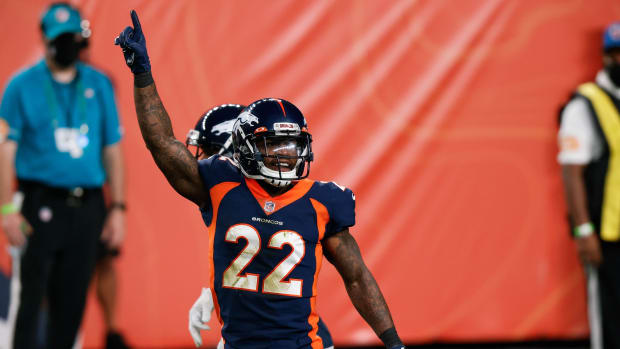 Denver Broncos strong safety Kareem Jackson (22) celebrates after a play in the fourth quarter against the Tennessee Titans at Empower Field at Mile High.